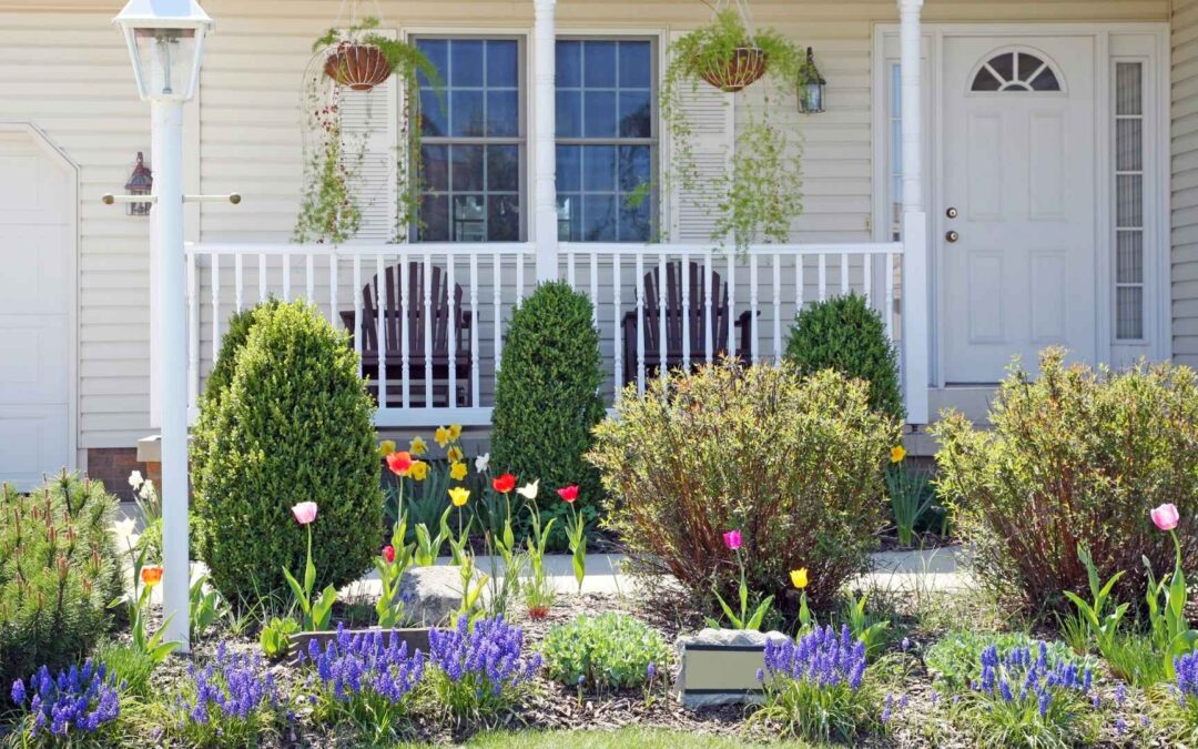 pretty white home with spring landscaping